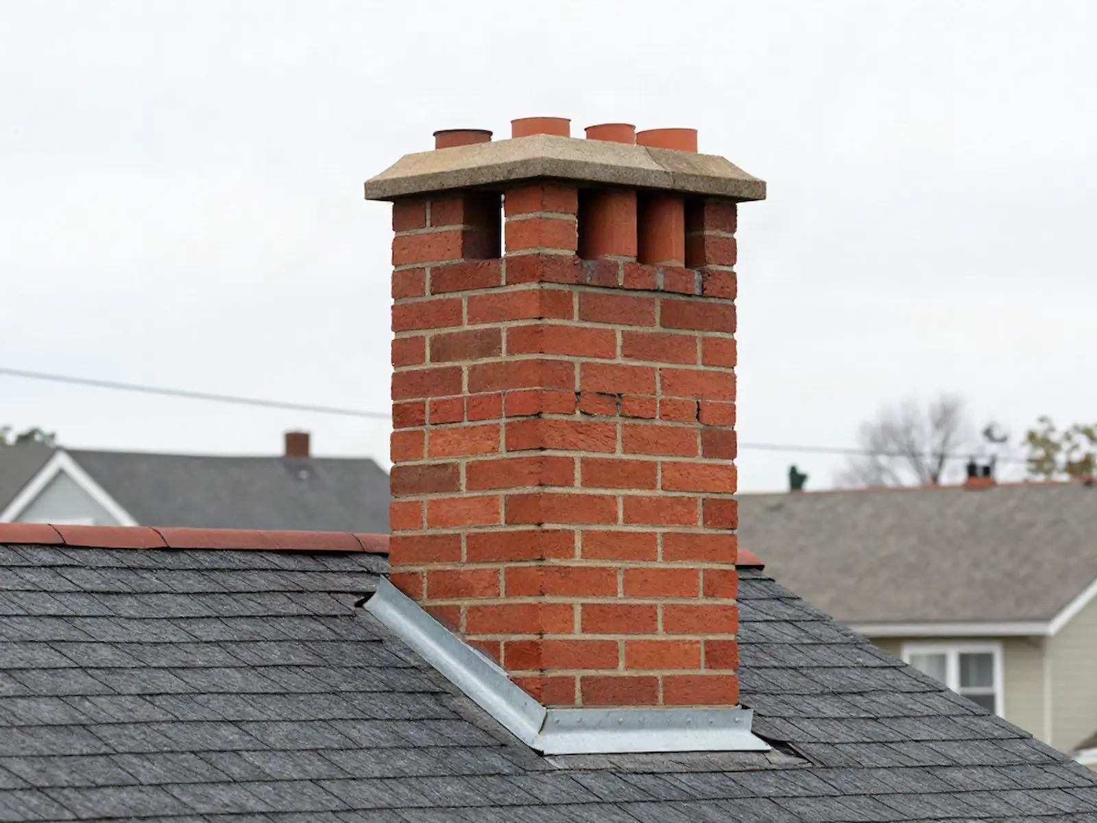 Brick chimney on a home served by Manley & Sons Chimney Care in Chicago, IL